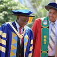 President William Ruto and Prof Simon Gicharu