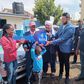 Rana Motors presents a dummy key as a car present to Faith Kipyegon's father in Eldoret