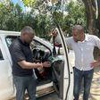 Seth Olale looks at the shattered windows of Citizen TV vehicle