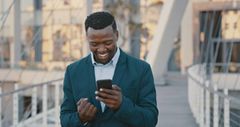 Man excited looking at the phone