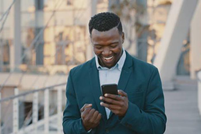 Blackman excited looking at the phone