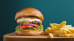 Photo of beef cheeseburger with a side of fries [Image Credit: Daniel Reche]
