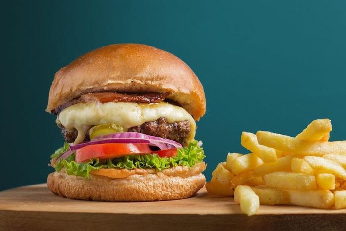 Photo of beef cheeseburger with a side of fries [Image Credit: Daniel Reche]