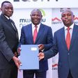 Dr James Mwangi, Equity Group Managing Director and CEO (centre), William Rahedi, Spire Bank Board Chairman (right) and Joel Gachari, Mwalimu National Sacco National Chairman (right) during the partnership signing ceremony