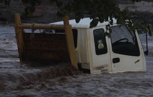 A lorry stuck inside Muswii River in Makueni County