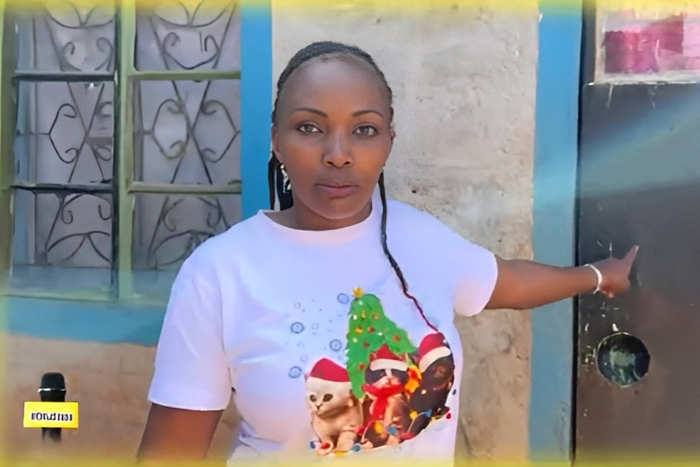 A screengrab image of KRG The Don’s alleged baby mama, Susan pointing at the room where Yvonne was allegedly conceived in Ndumberi [YouTube]