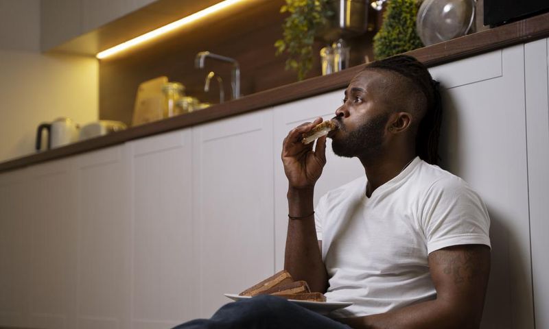 A man eating while on the floor