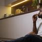 A man eating while on the floor