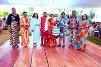 CSs Aisha Jumwa, Susan Nakhumicha, Rebecca Miano, Florence Bore, Soipan Tuya, and Secretary to the Cabinet Mercy Wanjau pose with Peter Miano and his wife Wambui Kibe