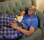 General Francis Ogolla with his grandson Taji Mbarara.