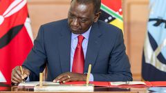 President William Ruto signs a document at State House, Nairobi on May 2, 2024