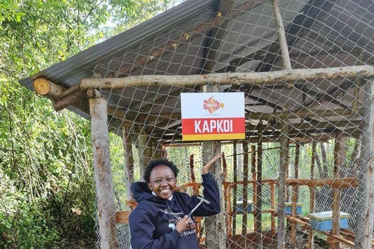 Charlene Ruto branding the location of her hives