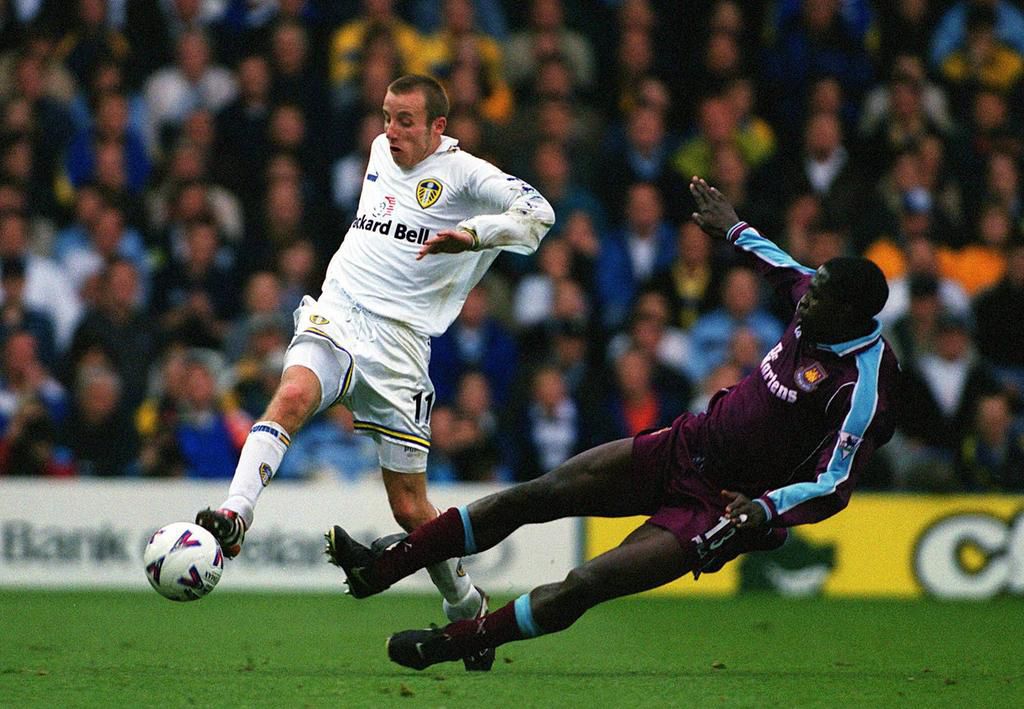Lee Bowyer (Leeds) skips past the late Marc Vivien Foe (West Ham) on October 30, 1999.