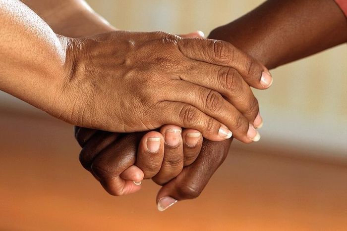 Two people holding hands [Photo: Pixabay]