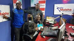 Hassan Ali Kauleni (seated) posing with Nuru Ya Lugha panelists.