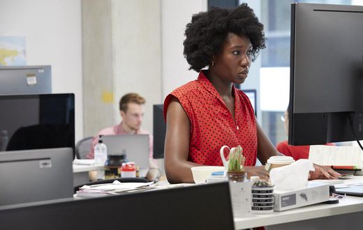 Female software engineer at desk