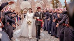 Jordan's Crown Prince Hussein and Rajwa Alseif walk together on the day of their royal wedding, in Amman, Jordan on June 1, 2023
