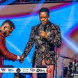 Diamond Platnumz being prayed for by a preacher