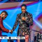 Diamond Platnumz being prayed for by a preacher