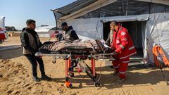 Patients receive treatment in a field hospital built by the International Medical Corps on January 16, 2024 in Rafah, Gaza.Ahmad Hasaballah/Getty Images