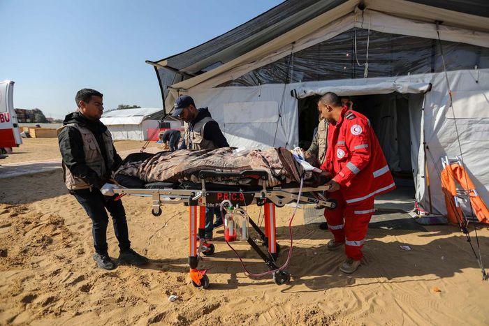 Patients receive treatment in a field hospital built by the International Medical Corps on January 16, 2024 in Rafah, Gaza.Ahmad Hasaballah/Getty Images