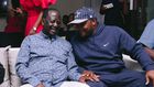 ODM leader Raila Odinga speaks with Lang'ata MP Jalang'o during a birthday party at Saboti MP Caleb Amisi's house