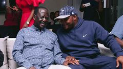 ODM leader Raila Odinga speaks with Lang'ata MP Jalang'o during a birthday party at Saboti MP Caleb Amisi's house