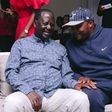 ODM leader Raila Odinga speaks with Lang'ata MP Jalang'o during a birthday party at Saboti MP Caleb Amisi's house