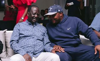 ODM leader Raila Odinga speaks with Lang'ata MP Jalang'o during a birthday party at Saboti MP Caleb Amisi's house