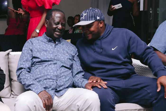 ODM leader Raila Odinga speaks with Lang'ata MP Jalang'o during a birthday party at Saboti MP Caleb Amisi's house