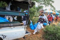 Police officers retrieve bodies at Shakahola Forest in Kilifi county
