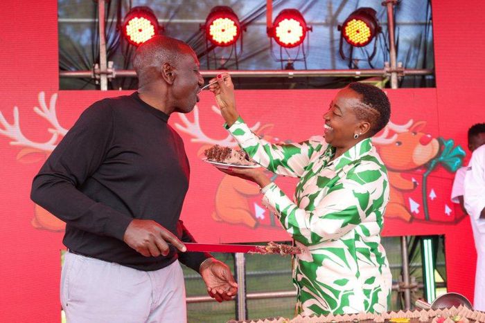 Rachel Ruto feeds President William Ruto a cake at State House, Nairobi