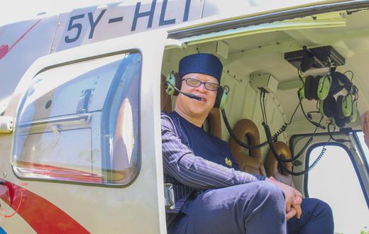 Government Spokesman Isaac Mwaura in a chopper