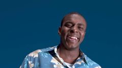 A man in a flowery pattern shirt