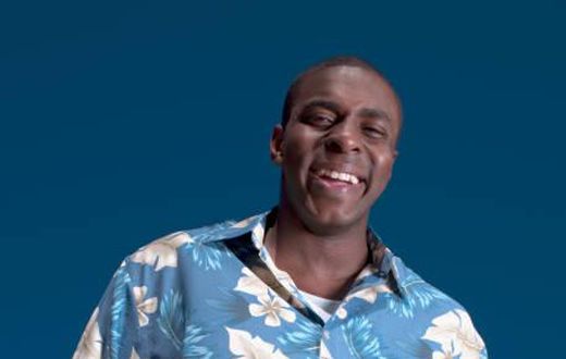 A man in a flowery pattern shirt