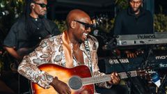 Bien-Aime Baraza plays the guitar during a listening party for 'Alusa Why Are You Topless?'