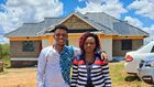 Sammy Kioko and his mother in their newly constructed house
