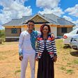 Sammy Kioko and his mother in their newly constructed house