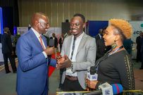 President William Ruto chats with Eddie Butita during a past event at KICC, Nairobi
