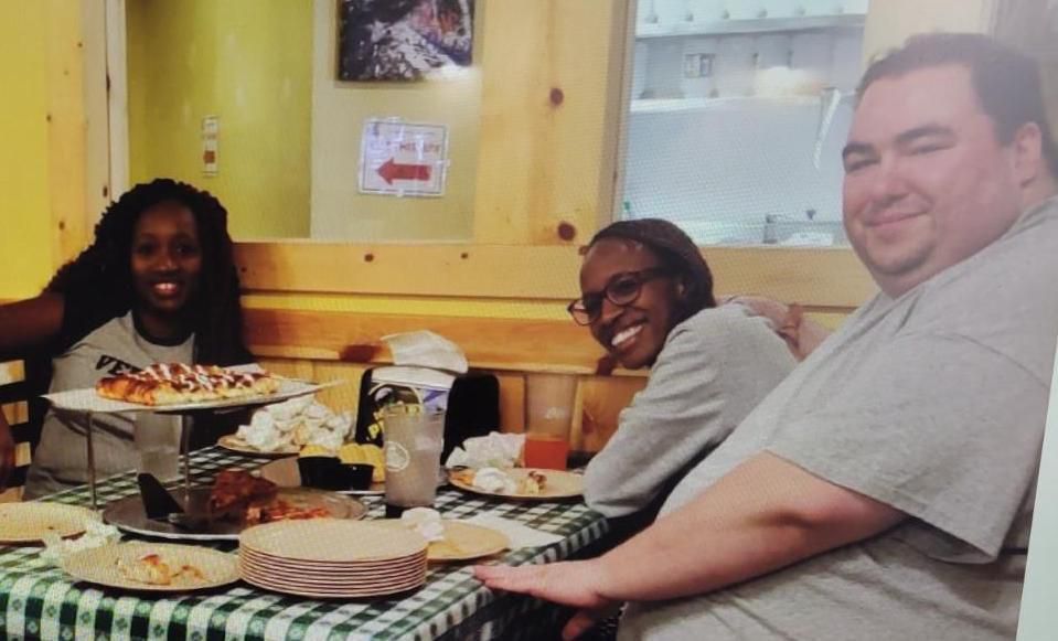 Susan Minkovsky (left) enjoys dinner with Irene Gakwa and Nathan Hightman during a visit with the couple in Meridian, Idaho in summer 2020. (Courtesy photo from Susan Minkovsky)