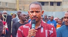 Embakasi East MP Babu Owino handing out bursary cheques