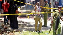 Police officers at a past crime scene