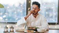 A man having supper [Image Credit: Michael Burrows]