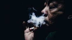 An old man smoking cigarette