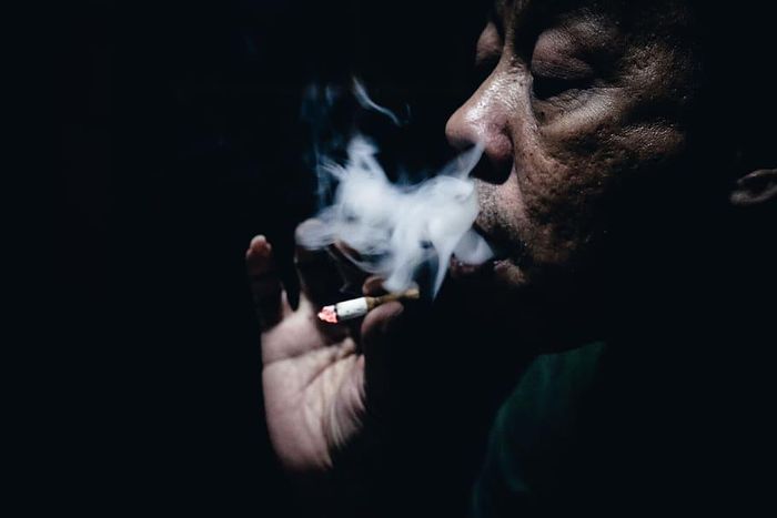 An old man smoking cigarette