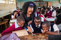 Young Scientists Kenya (YSK) instructor guides Science, Technology, Engineering, and Mathematics (STEM) learners during a workshop in Nairobi
