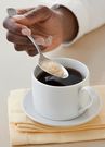 Adding sugar to tea