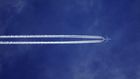 Bottom view of plane with contrail [Credit: SevenStorm JUHASZIMRUS]