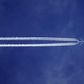 Bottom view of plane with contrail [Credit: SevenStorm JUHASZIMRUS]