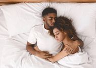 A couple in bed [istockphoto]